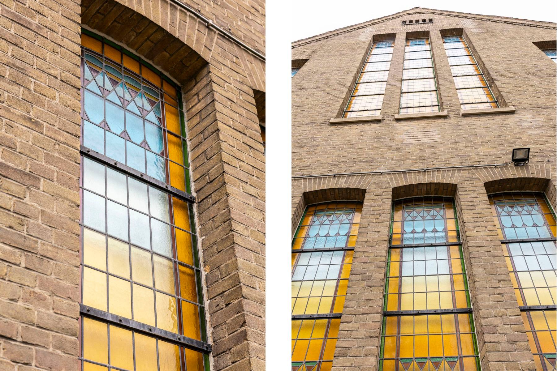 The Zuiderkerk's tall leaded windows seen from outside.