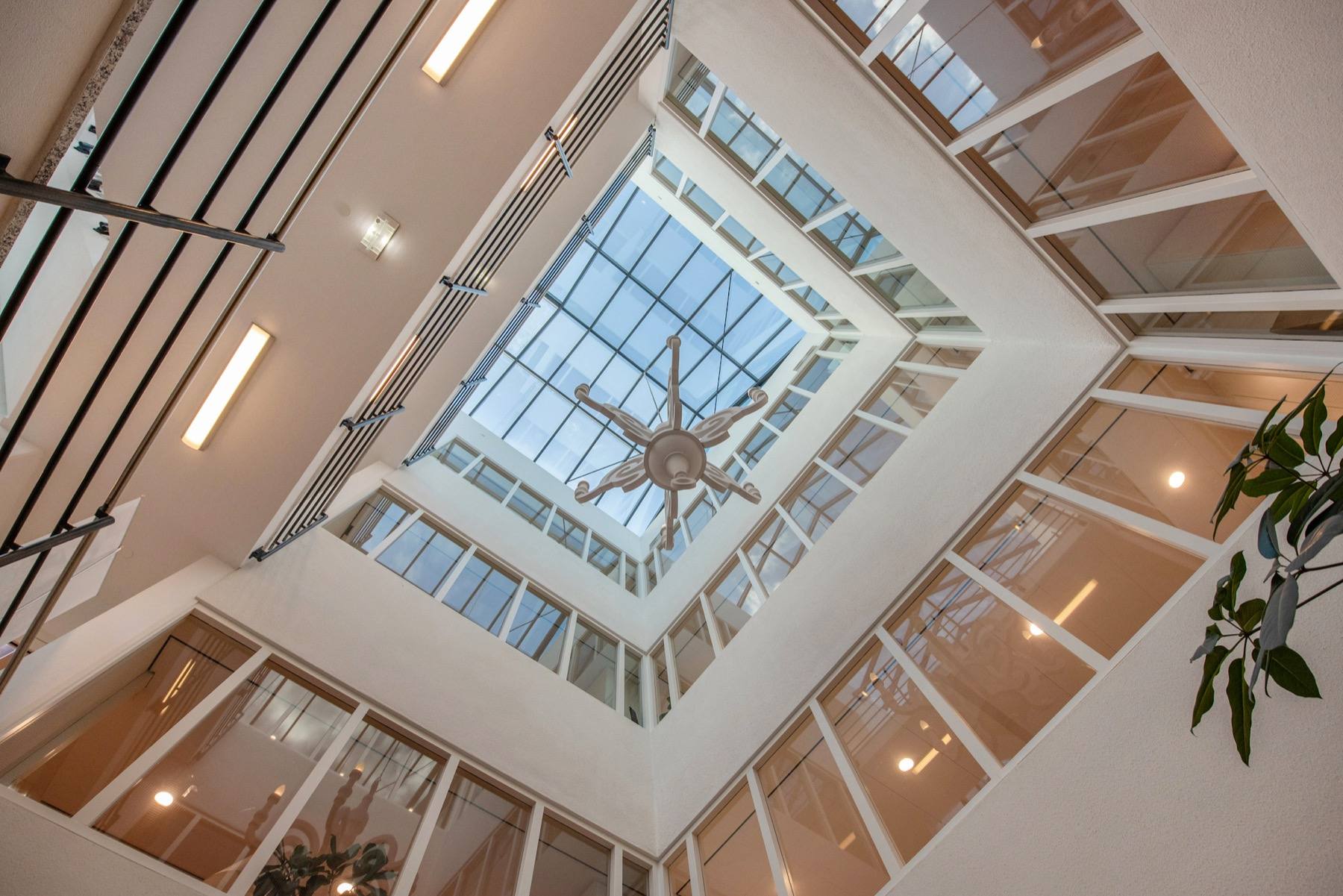 The building's atrium, looking up through the glazed roof.